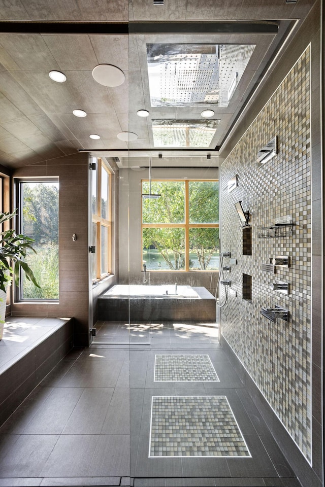 10463 W H Ave, Kalamazoo, MI 49009 - interior space featuring a tub and a tile shower