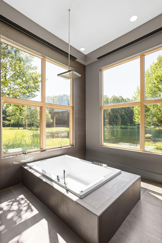 10463 W H Ave, Kalamazoo, MI 49009 - bathroom with a garden tub and tile patterned flooring