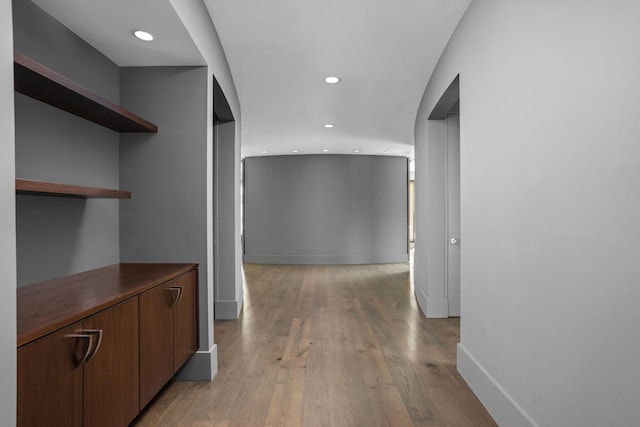 10463 W H Ave, Kalamazoo, MI 49009 - hall featuring recessed lighting, baseboards, light wood-type flooring, and arched walkways