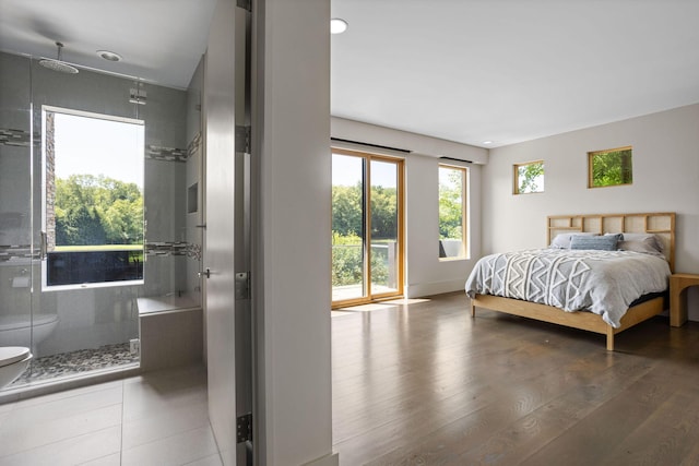 10463 W H Ave, Kalamazoo, MI 49009 - bedroom featuring baseboards, recessed lighting, wood finished floors, and access to exterior
