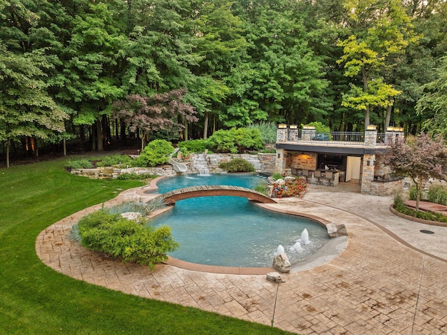10463 W H Ave, Kalamazoo, MI 49009 - pool featuring a water slide, a jacuzzi, a yard, and a patio area