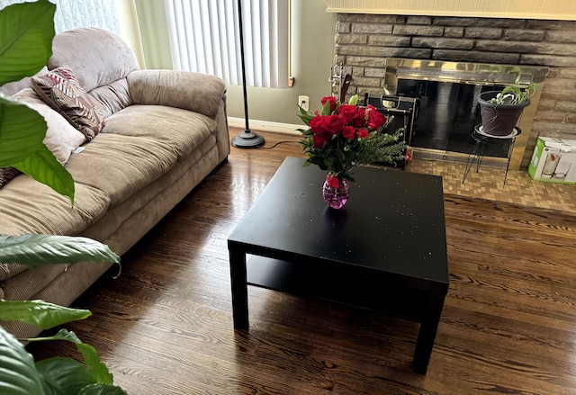 16545 E 8 Mile Rd, Eastpointe, MI 48021 - living area with baseboards, a glass covered fireplace, and wood finished floors