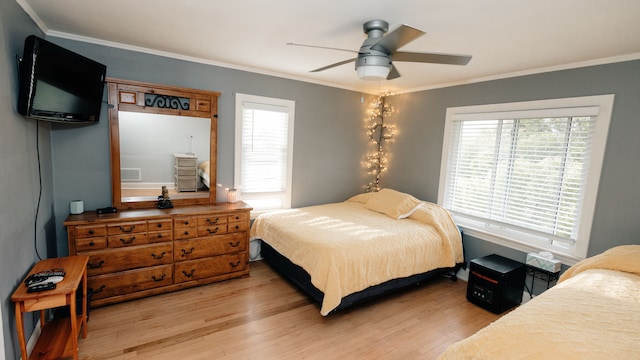 15261 Demean Ave, Allen Park, MI 48101 - bedroom with light wood finished floors, crown molding, and ceiling fan