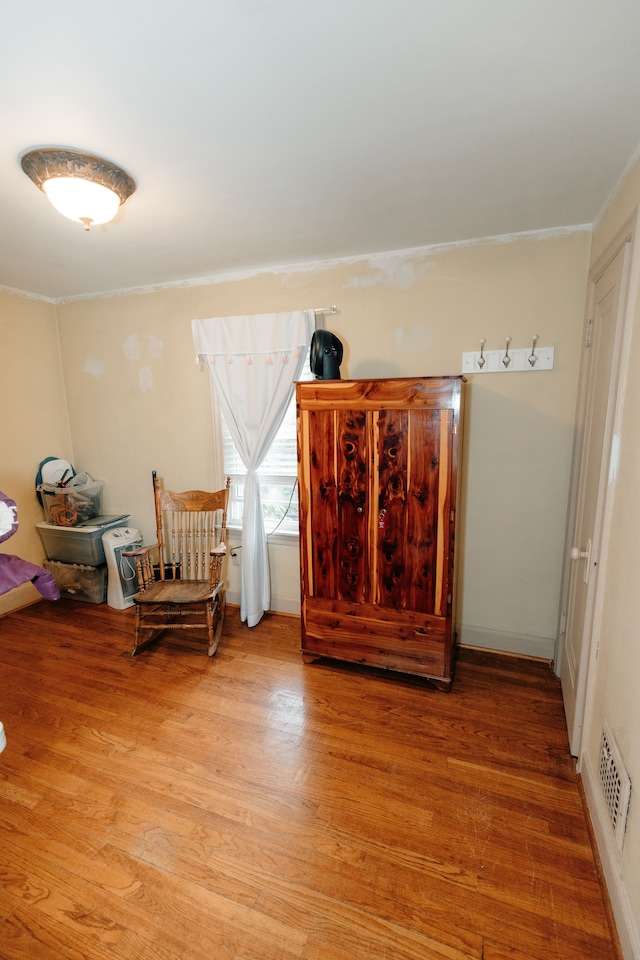 15261 Demean Ave, Allen Park, MI 48101 - living area featuring light wood-style flooring and crown molding