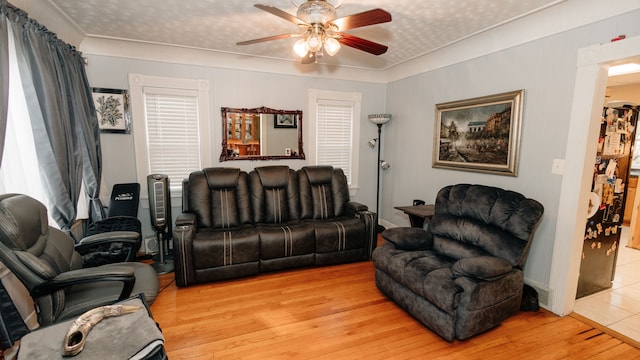 15261 Demean Ave, Allen Park, MI 48101 - living room featuring a ceiling fan, wood-type flooring, and ornamental molding