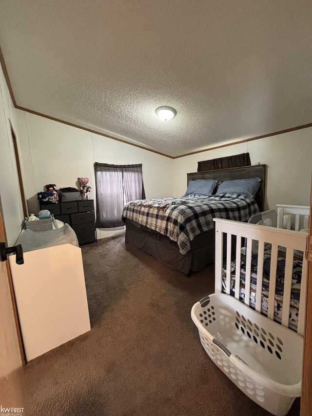 bedroom featuring crown molding, a textured ceiling, and carpet