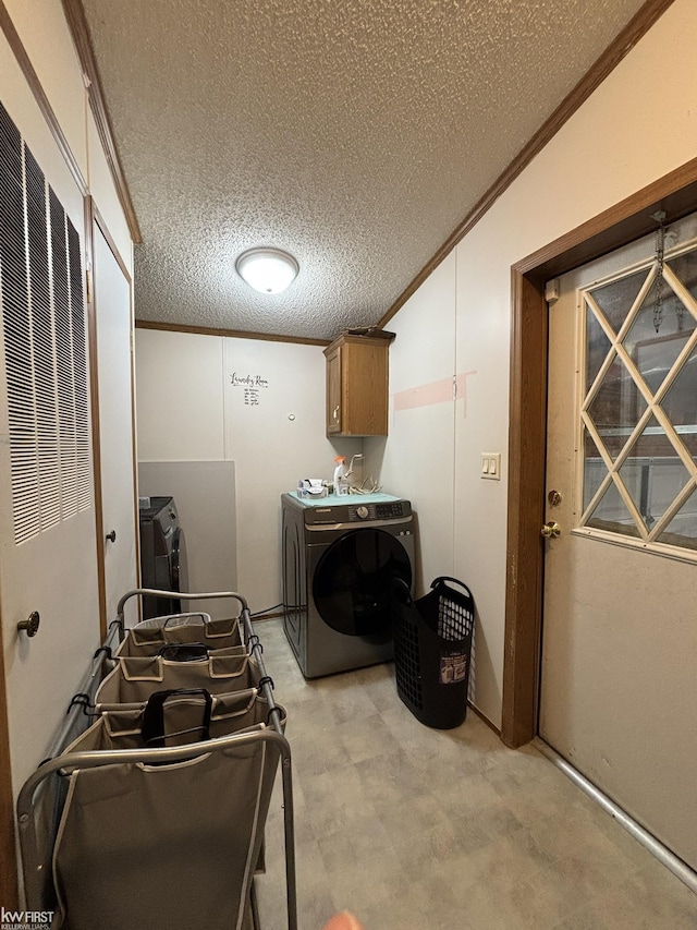 washroom with a textured ceiling, independent washer and dryer, cabinet space, light floors, and ornamental molding