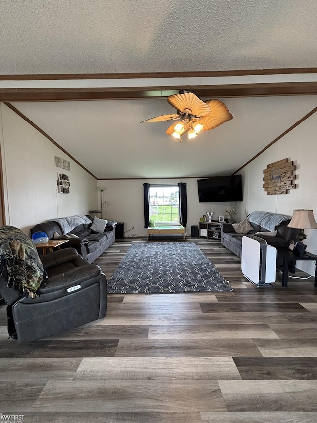 living room with vaulted ceiling with beams, a textured ceiling, and wood finished floors