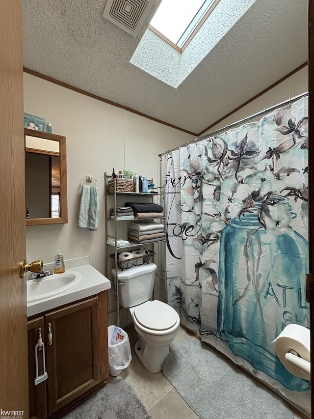 bathroom featuring vanity, toilet, a textured ceiling, visible vents, and ornamental molding