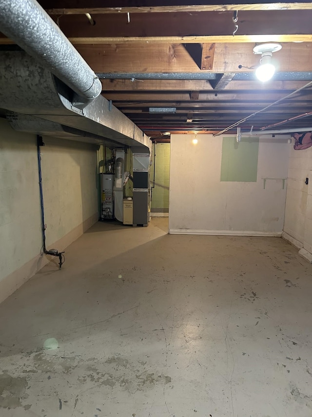unfinished below grade area with heating unit and water heater