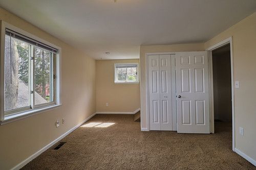unfurnished bedroom featuring a closet, baseboards, carpet flooring, and visible vents