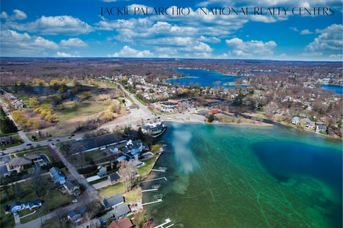 birds eye view of property featuring a residential view and a water view