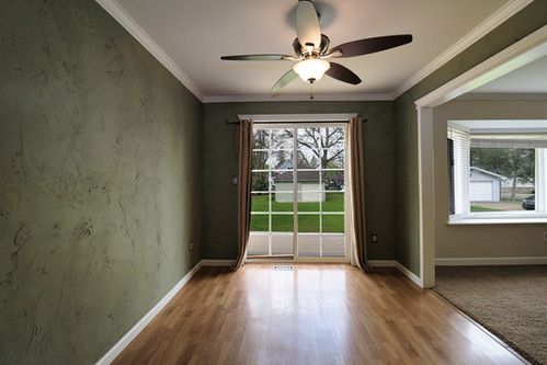 doorway featuring plenty of natural light, ceiling fan, and wood finished floors