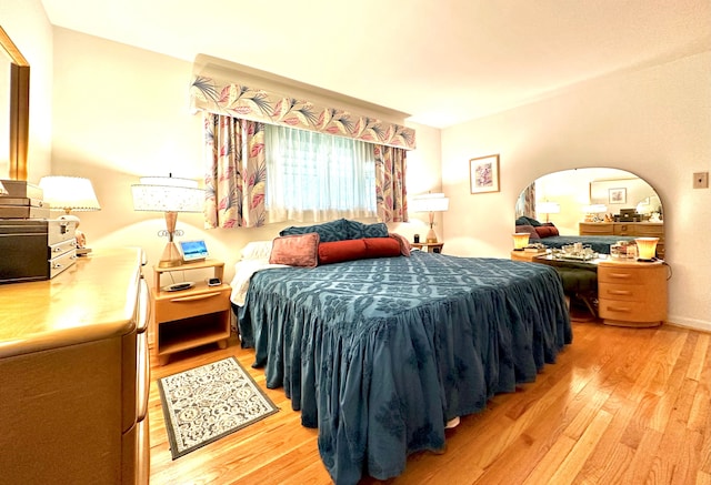 9186 Arnold St, Redford, MI 48239 - bedroom with light wood-style floors and arched walkways