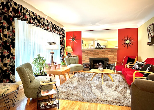 9186 Arnold St, Redford, MI 48239 - living room featuring wood finished floors and a fireplace