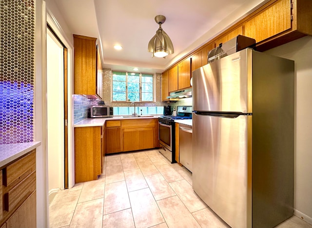9186 Arnold St, Redford, MI 48239 - kitchen featuring appliances with stainless steel finishes, under cabinet range hood, a sink, tasteful backsplash, and recessed lighting