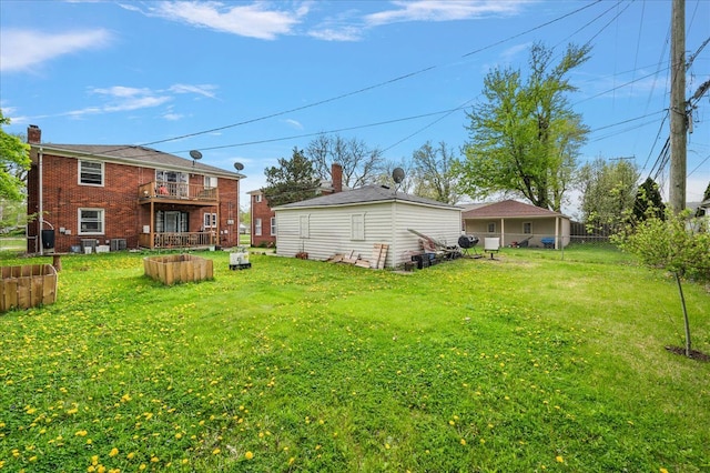 2180 Vernier Rd, Grosse Pointe Woods, MI 48236 - view of yard with a balcony and fence