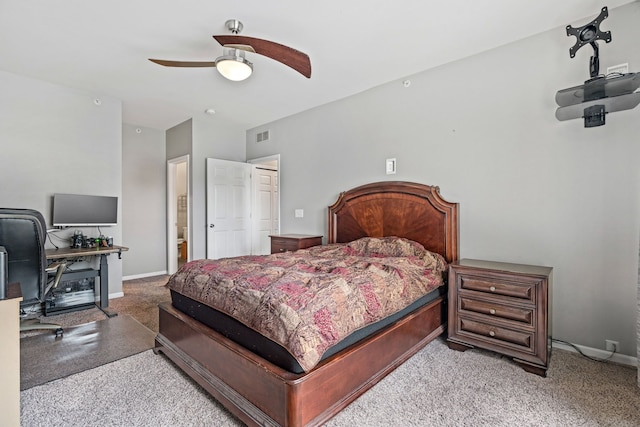 carpeted bedroom with visible vents, baseboards, and ceiling fan