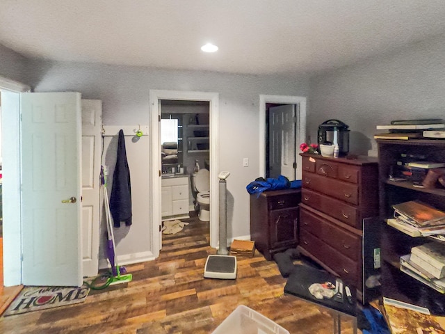 bedroom with recessed lighting and wood finished floors