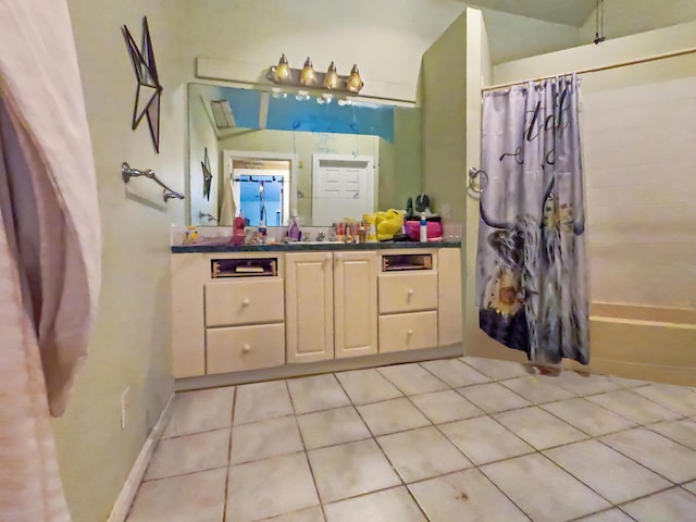 bathroom with vanity, shower / bath combo, and tile patterned floors