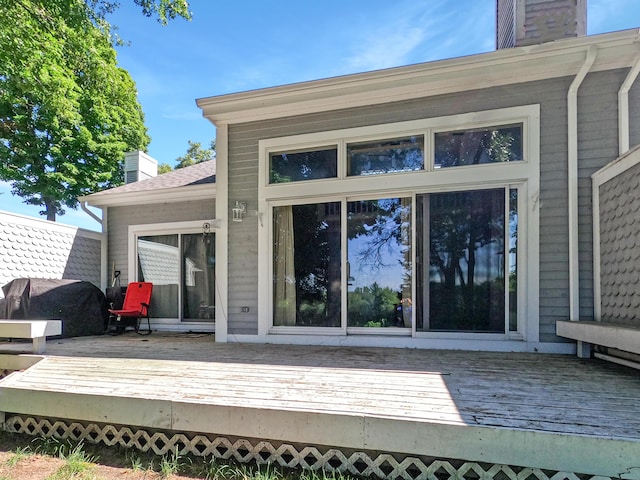 exterior space with a chimney and a deck