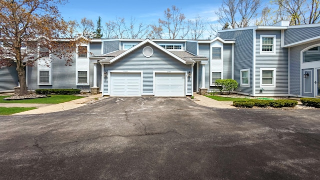 view of front facade with driveway and a garage