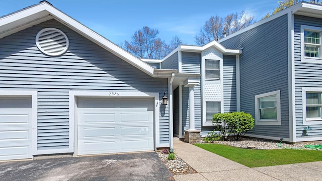 view of front of property featuring an attached garage and driveway