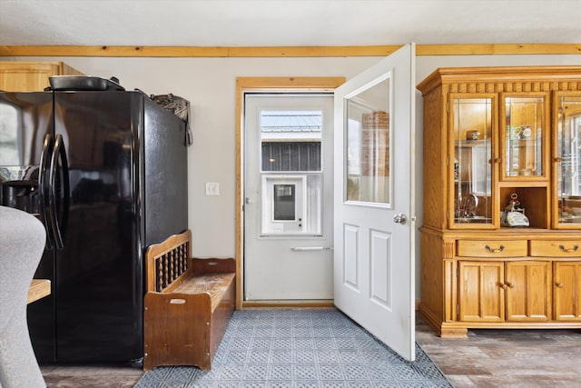 kitchen featuring black fridge with ice dispenser