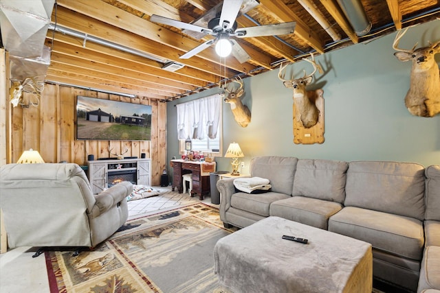 living room with a ceiling fan and visible vents
