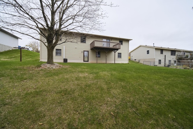rear view of property with a yard
