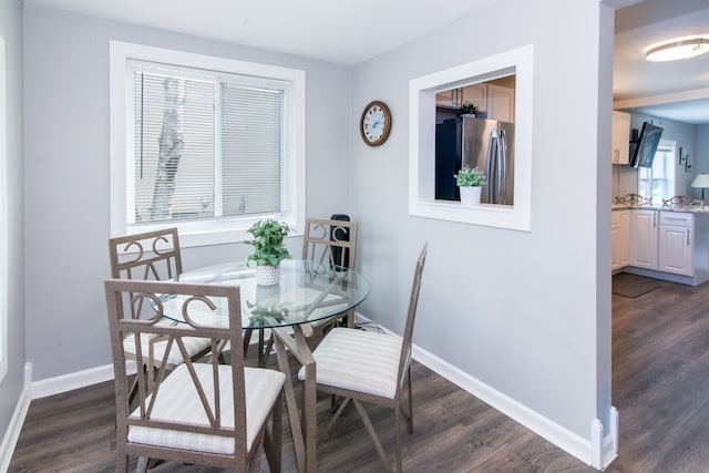 1291 E Lake Dr, Novi, MI 48377 - dining area with dark wood-style flooring and baseboards