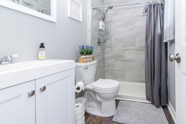 1291 E Lake Dr, Novi, MI 48377 - bathroom with a shower stall, toilet, vanity, and wood finished floors