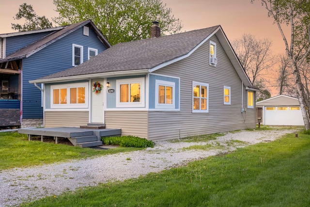 1291 E Lake Dr, Novi, MI 48377 - bungalow-style home featuring a chimney, roof with shingles, a yard, and an outbuilding