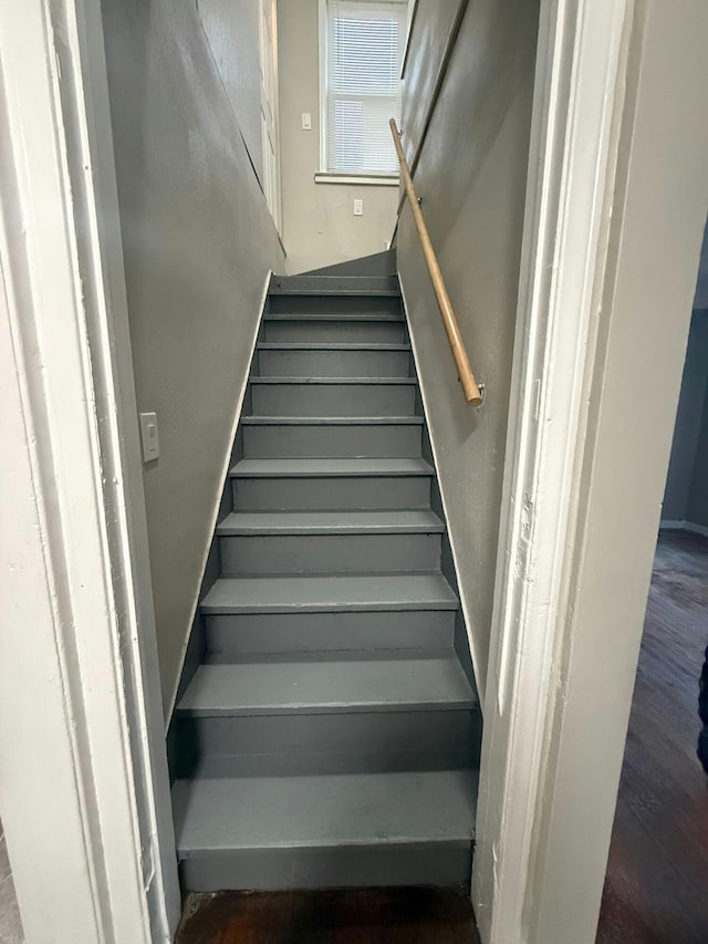 staircase featuring wood finished floors