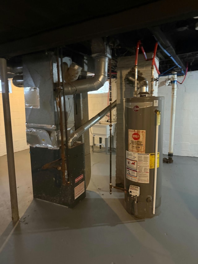 unfinished basement with concrete block wall, heating unit, and water heater