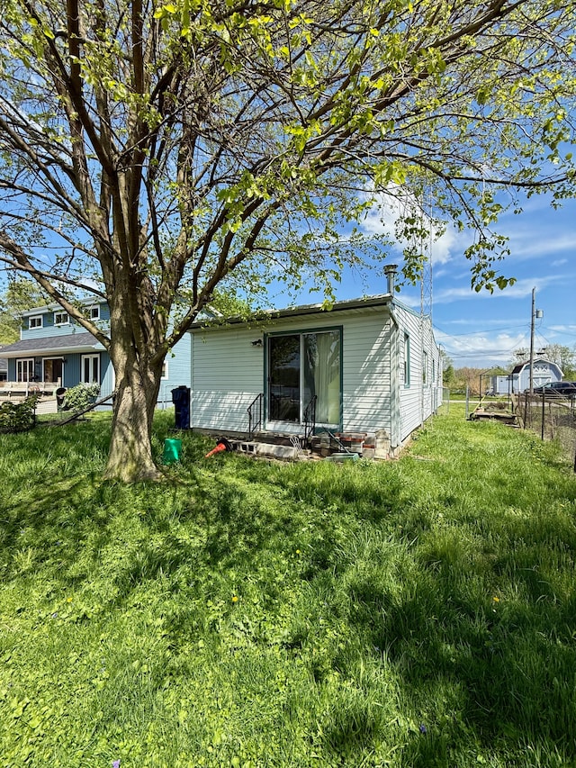 2964 Morin Point St, Erie, MI 48133 - view of side of home with a yard and fence