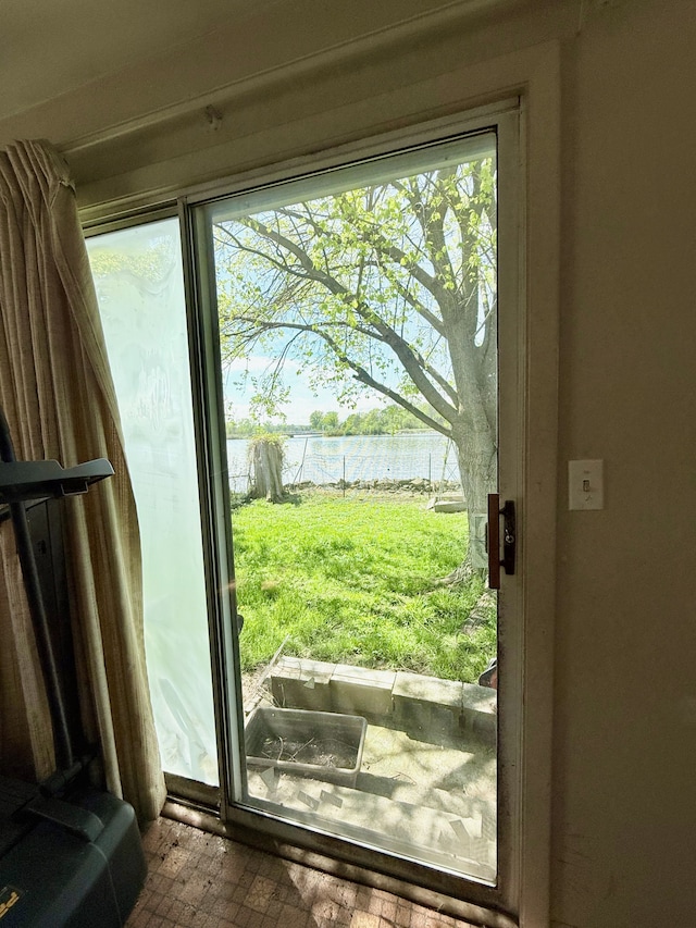 2964 Morin Point St, Erie, MI 48133 - doorway to outside with a water view, a healthy amount of sunlight, and brick floor
