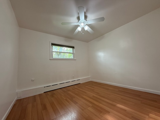 5781 Wright Dr, Troy, MI 48098 - unfurnished room with light wood-type flooring, baseboards, baseboard heating, and a ceiling fan