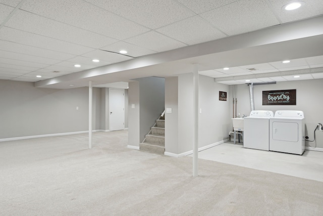 finished basement featuring a drop ceiling, independent washer and dryer, recessed lighting, and carpet