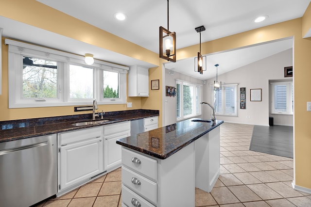 1095 Oregon Blvd, Waterford, MI 48327 - kitchen with a sink, stainless steel dishwasher, lofted ceiling, and an island with sink