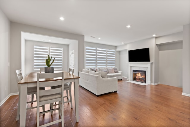 4867 Glenora Dr, Lake Orion, MI 48359 - living room with wood finished floors, a premium fireplace, healthy amount of natural light, and recessed lighting