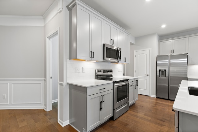 4867 Glenora Dr, Lake Orion, MI 48359 - kitchen with stainless steel appliances, light countertops, dark wood-style flooring, recessed lighting, and backsplash