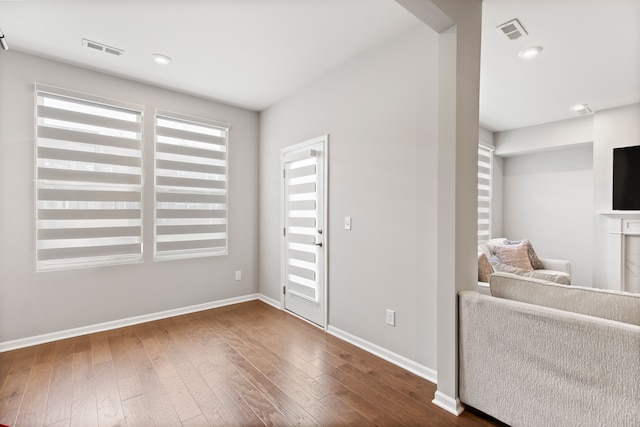 4867 Glenora Dr, Lake Orion, MI 48359 - unfurnished living room featuring dark wood finished floors, baseboards, and recessed lighting
