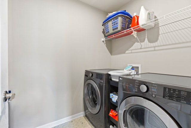 4867 Glenora Dr, Lake Orion, MI 48359 - washroom with washing machine and clothes dryer and baseboards