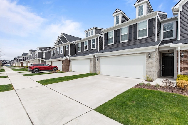 4867 Glenora Dr, Lake Orion, MI 48359 - townhome / multi-family property with a garage, a residential view, and concrete driveway
