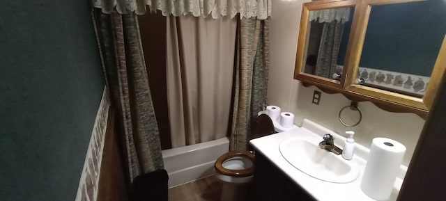 full bathroom featuring shower / bath combination with curtain, toilet, and vanity