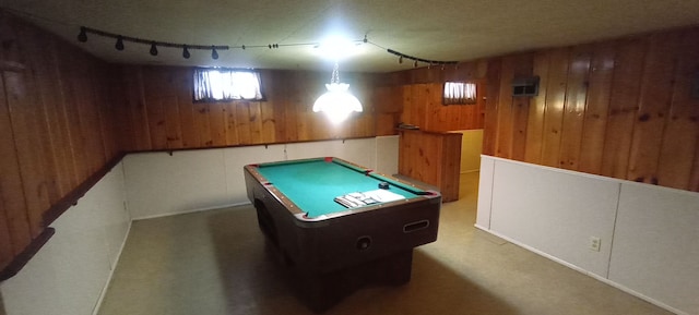 rec room featuring wooden walls, rail lighting, and pool table