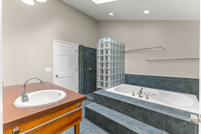 4938 Lincoln Blvd, Dearborn Heights, MI 48125 - bathroom featuring a garden tub, walk in shower, tile patterned floors, vanity, and a skylight