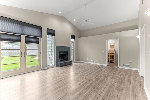4938 Lincoln Blvd, Dearborn Heights, MI 48125 - unfurnished living room with ceiling fan, light wood-style flooring, high vaulted ceiling, a fireplace with raised hearth, and baseboards