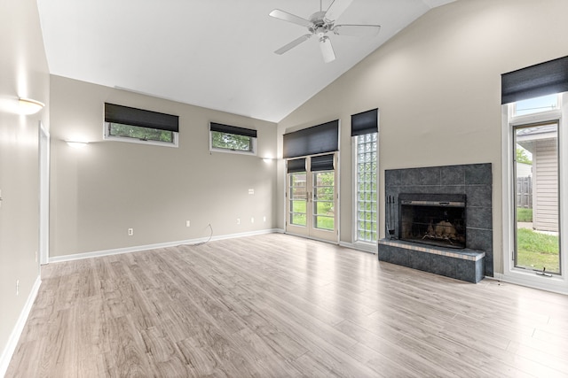4938 Lincoln Blvd, Dearborn Heights, MI 48125 - unfurnished living room featuring high vaulted ceiling, light wood-style floors, healthy amount of natural light, ceiling fan, and a tile fireplace